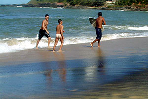 Children playing on the radioactive beach of Guarapari